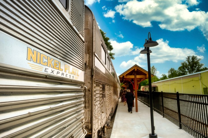 a train is parked on the side of a building