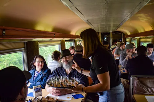 Duke dining car a group of people standing in front of a window