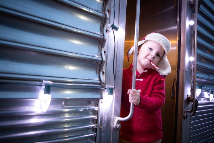 a person standing in front of a refrigerator