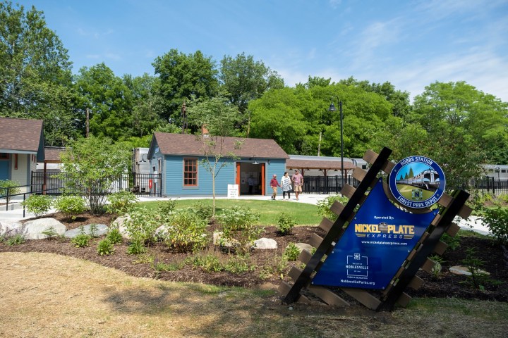 a sign in front of a house